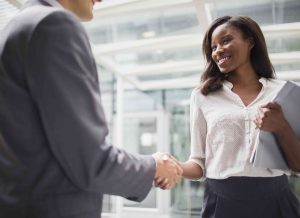 business-people-shaking-hands-outside-of-office-building-521813417-5954fdc33df78cdc2970d5ac